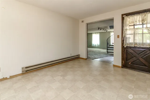 a view of an empty room with a window