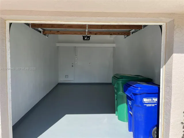 a view of walk in closet with clothes
