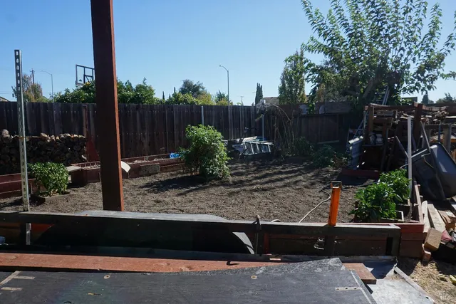 a backyard of a house with lots of green space
