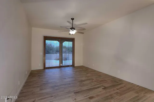 a bathroom with a sink double vanity granite and a shower