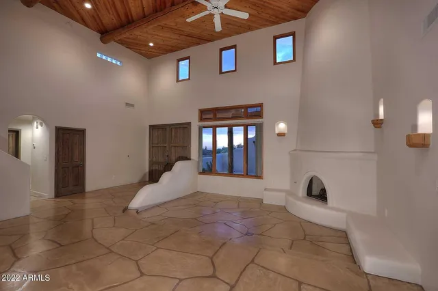 a kitchen with stainless steel appliances kitchen island granite countertop a refrigerator and cabinets