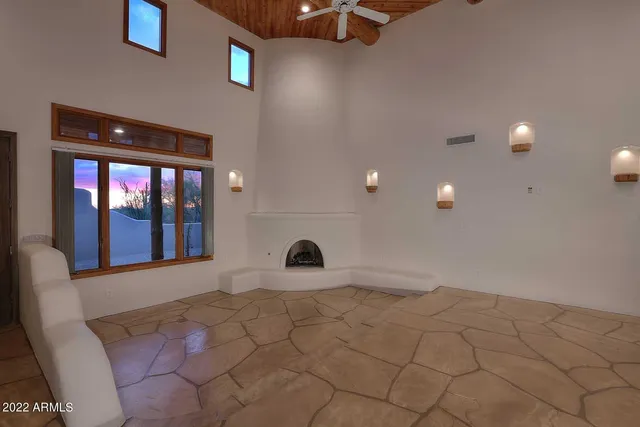 a kitchen with granite countertop a stove and cabinets