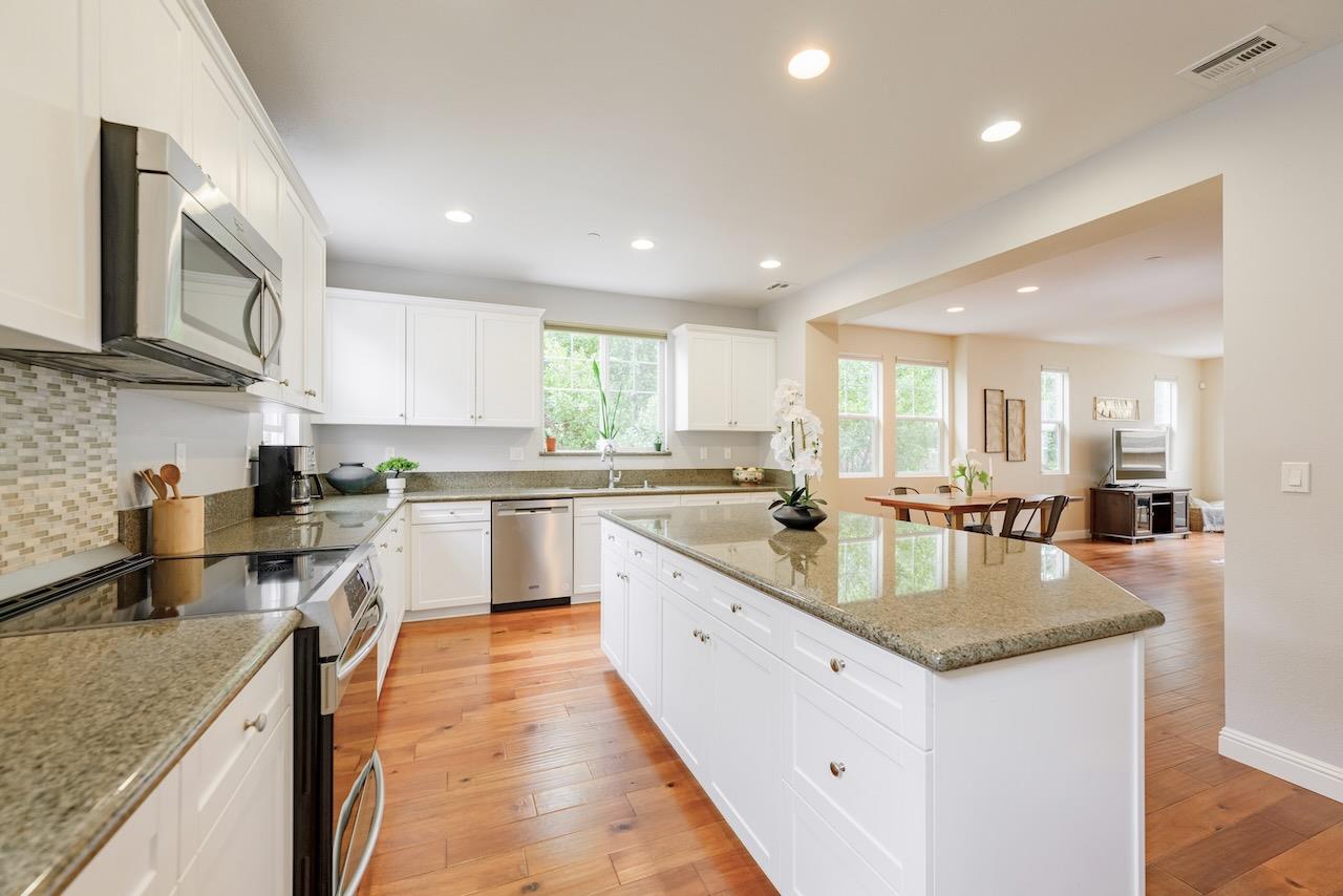 237 Bluebonnet Lane, Unit 304 Scotts Valley, CA 95066 - Photo 19 of 79 a large kitchen with sink a counter top space appliances and cabinets