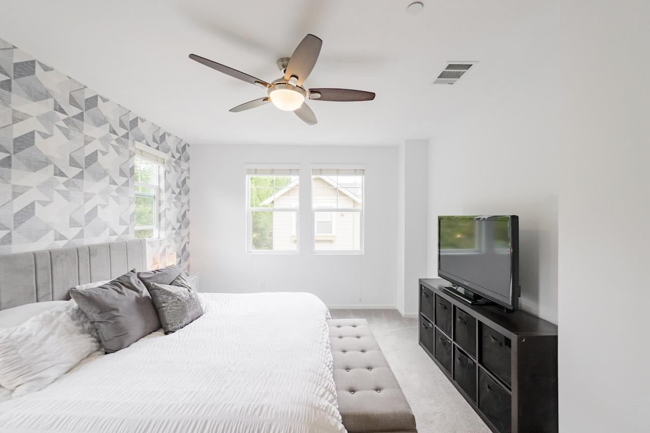 237 Bluebonnet Lane, Unit 304 Scotts Valley, CA 95066 - Photo 34 of 79 a bedroom with a bed and a flat screen tv