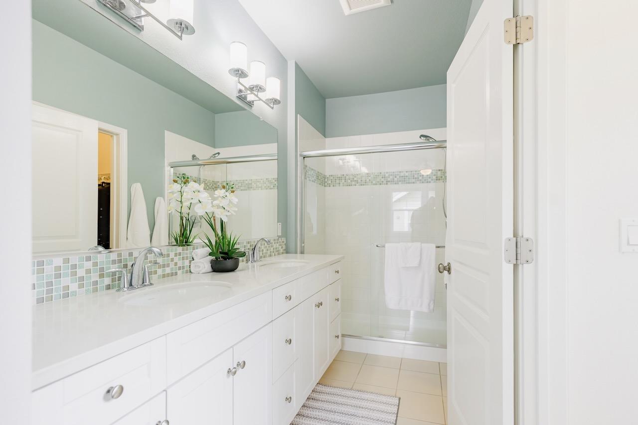 237 Bluebonnet Lane, Unit 304 Scotts Valley, CA 95066 - Photo 35 of 79 a bathroom with a double vanity sink mirror and shower