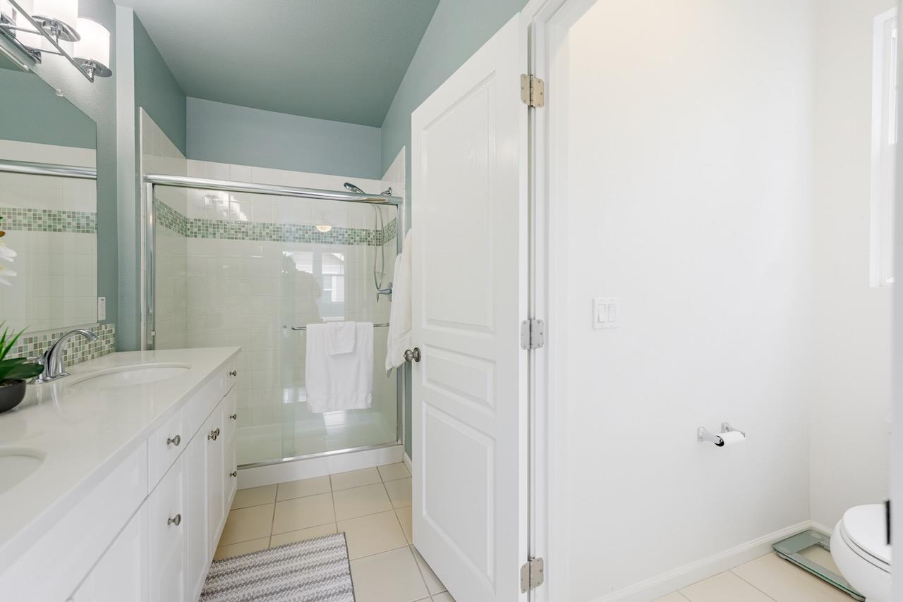 237 Bluebonnet Lane, Unit 304 Scotts Valley, CA 95066 - Photo 37 of 79 a bathroom with a double vanity sink toilet and shower