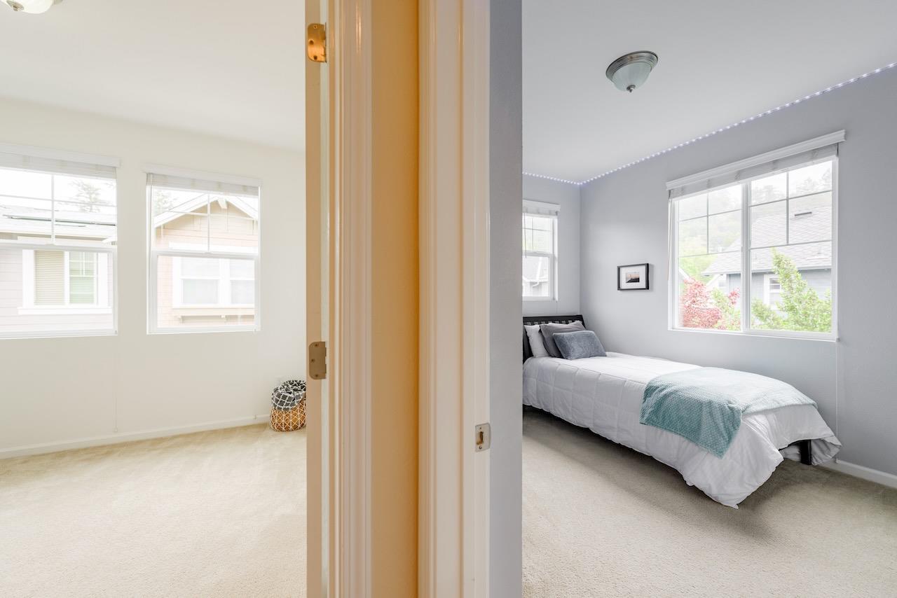 237 Bluebonnet Lane, Unit 304 Scotts Valley, CA 95066 - Photo 42 of 79 a bedroom with a bed and wooden floor