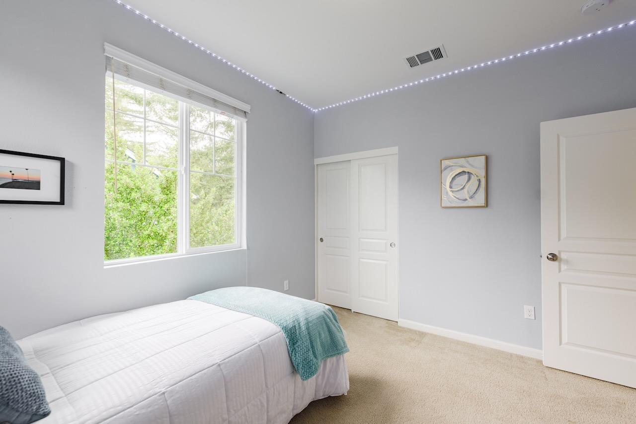 237 Bluebonnet Lane, Unit 304 Scotts Valley, CA 95066 - Photo 48 of 79 a bedroom with a bed and a window