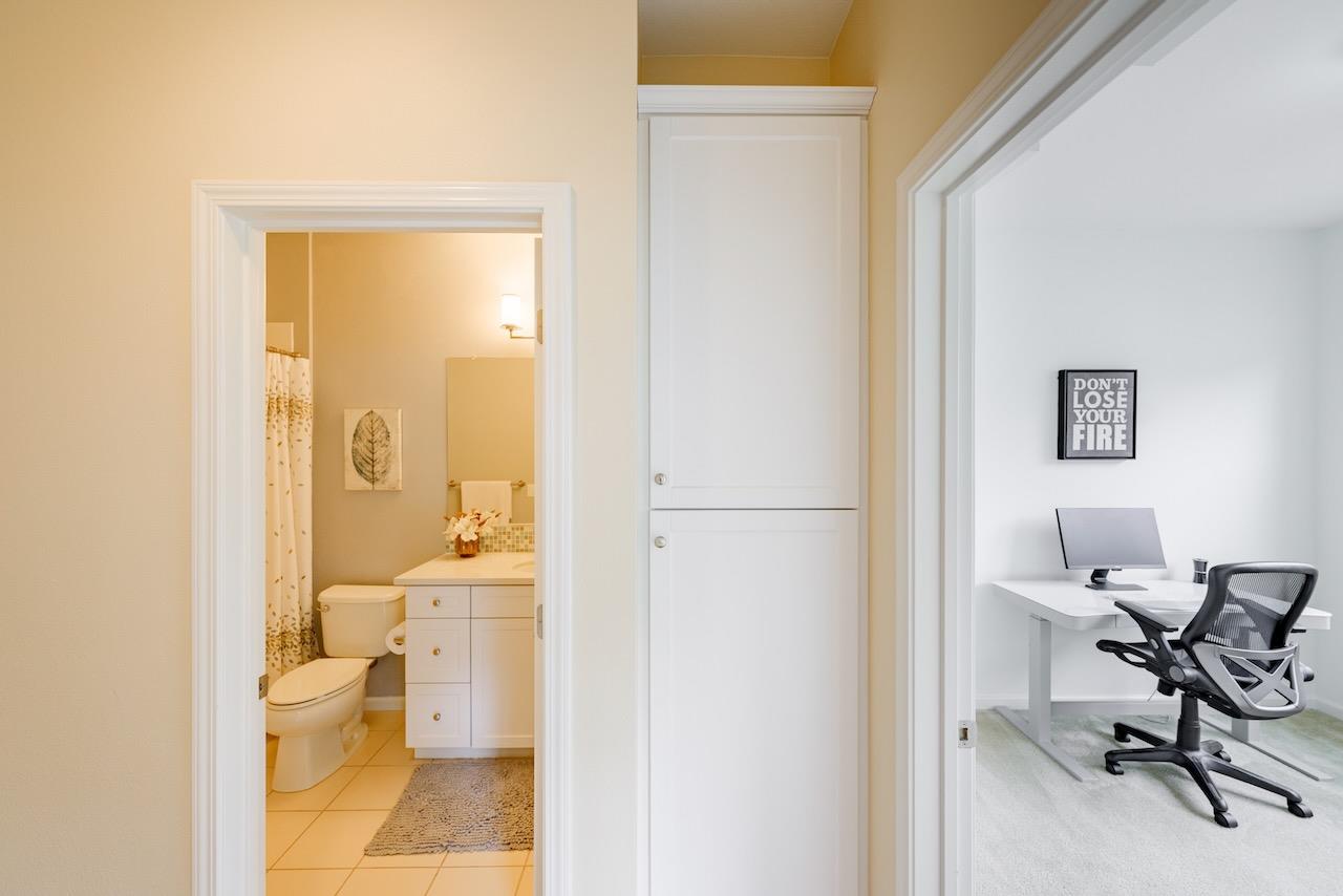 237 Bluebonnet Lane, Unit 304 Scotts Valley, CA 95066 - Photo 49 of 79 a bathroom with a toilet a sink and a mirror