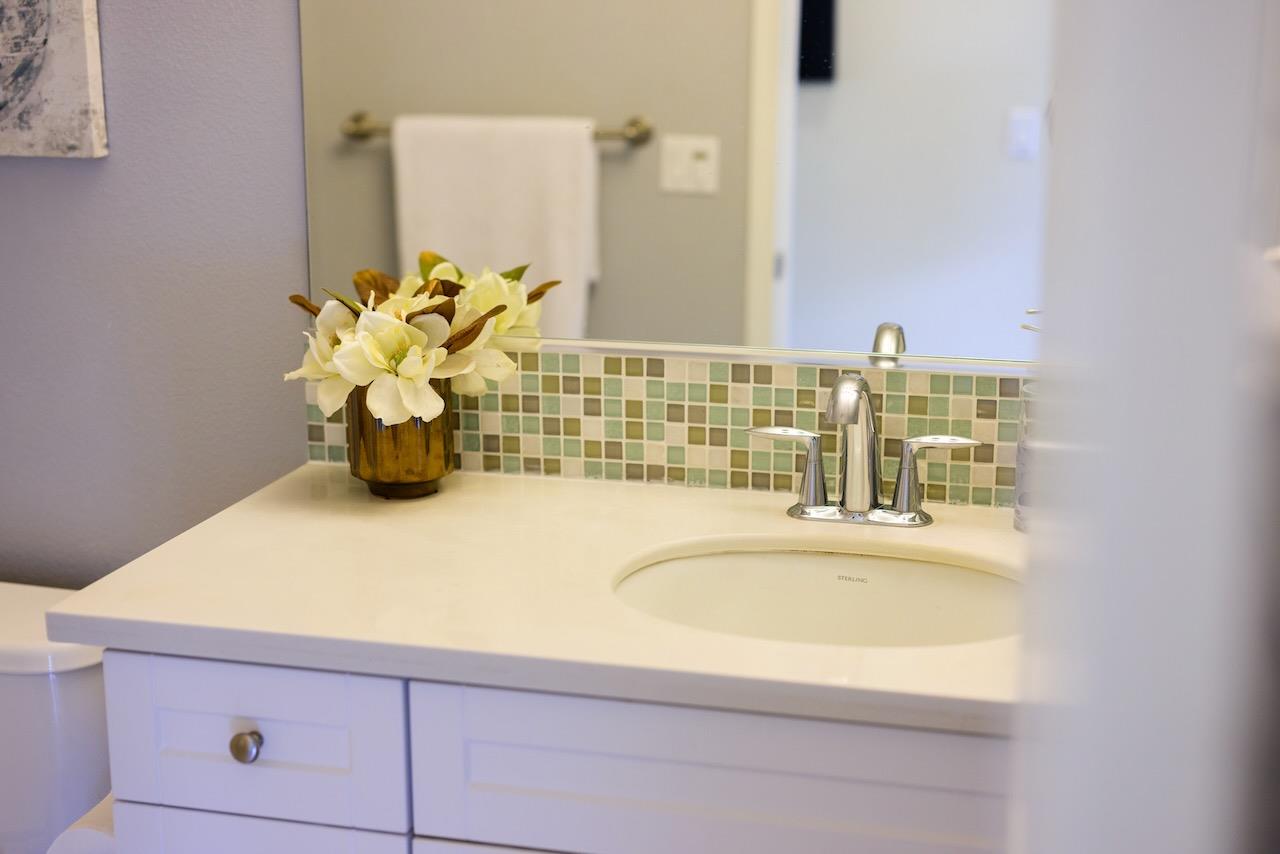 237 Bluebonnet Lane, Unit 304 Scotts Valley, CA 95066 - Photo 52 of 79 a bathroom with a granite countertop sink and a mirror