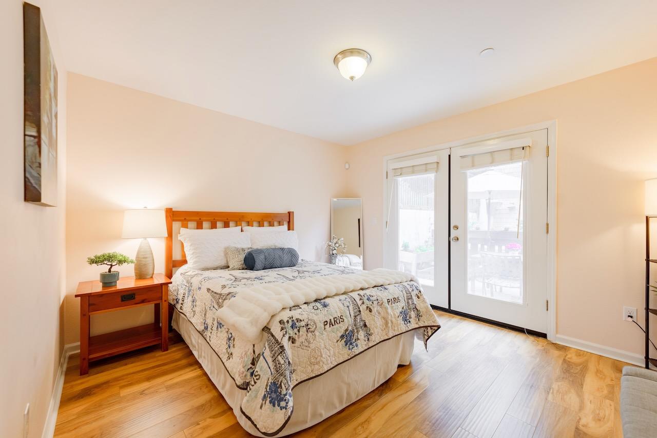 237 Bluebonnet Lane, Unit 304 Scotts Valley, CA 95066 - Photo 59 of 79 a bedroom with a bed and wooden floor