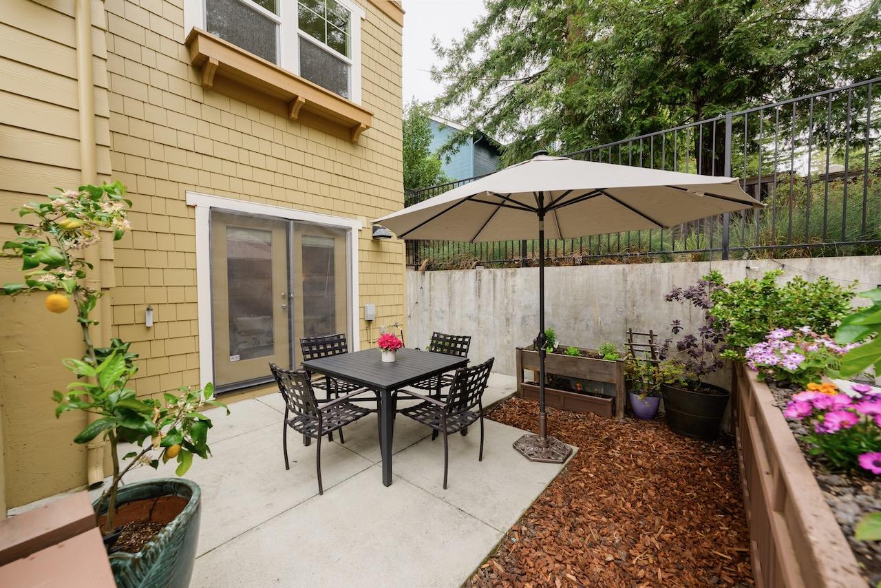 237 Bluebonnet Lane, Unit 304 Scotts Valley, CA 95066 - Photo 63 of 79 a view of a tables and chairs under an umbrella in the patio