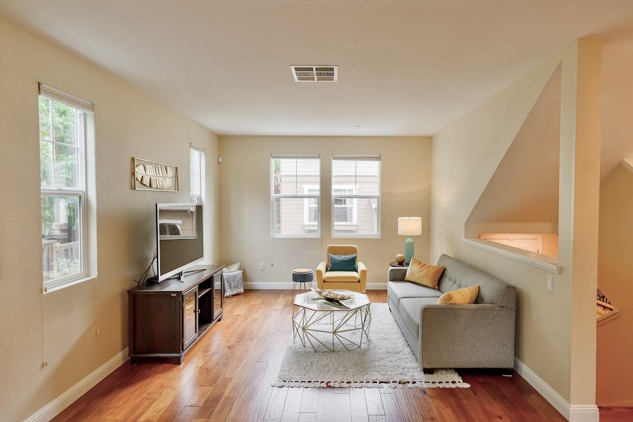 237 Bluebonnet Lane, Unit 304 Scotts Valley, CA 95066 - Photo 9 of 79 a living room with furniture a large window wooden floor and a rug