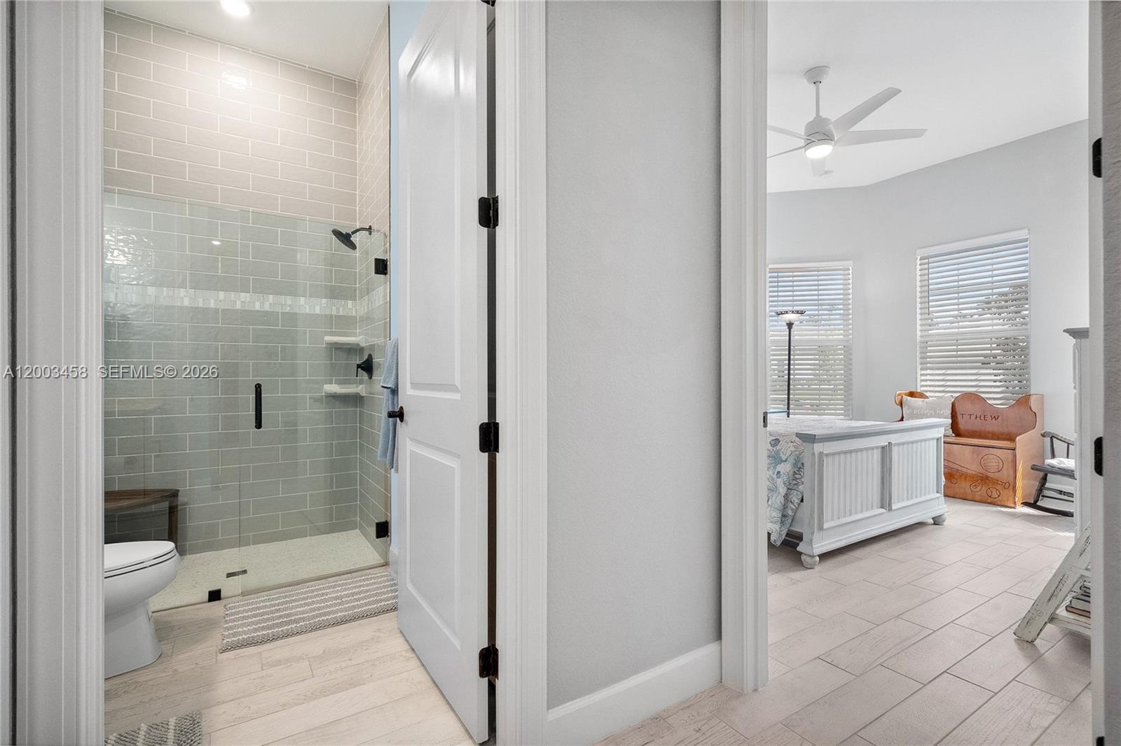 9734 Southwest Meridian Way Stuart, FL 34997 - Photo 28 of 48 a bathroom with a tub shower and sink
