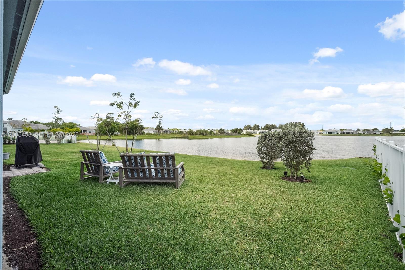 9734 Southwest Meridian Way Stuart, FL 34997 - Photo 37 of 48 a view of a garden with outdoor seating