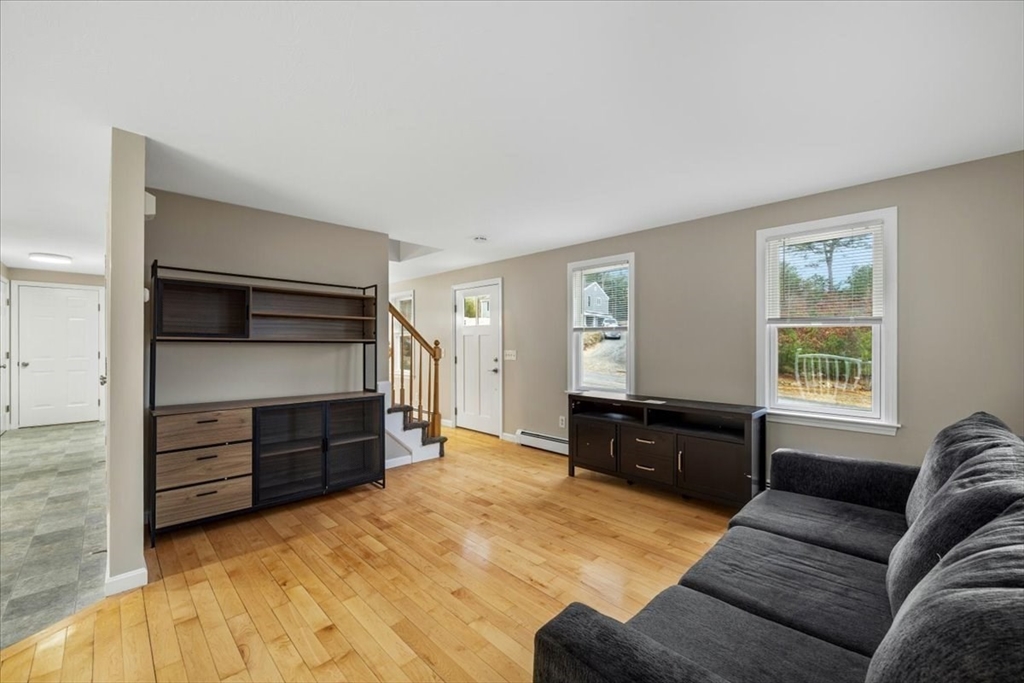 18 Heather Hill Road Bourne, MA 02532 - Photo 15 of 28 a living room with furniture and windows