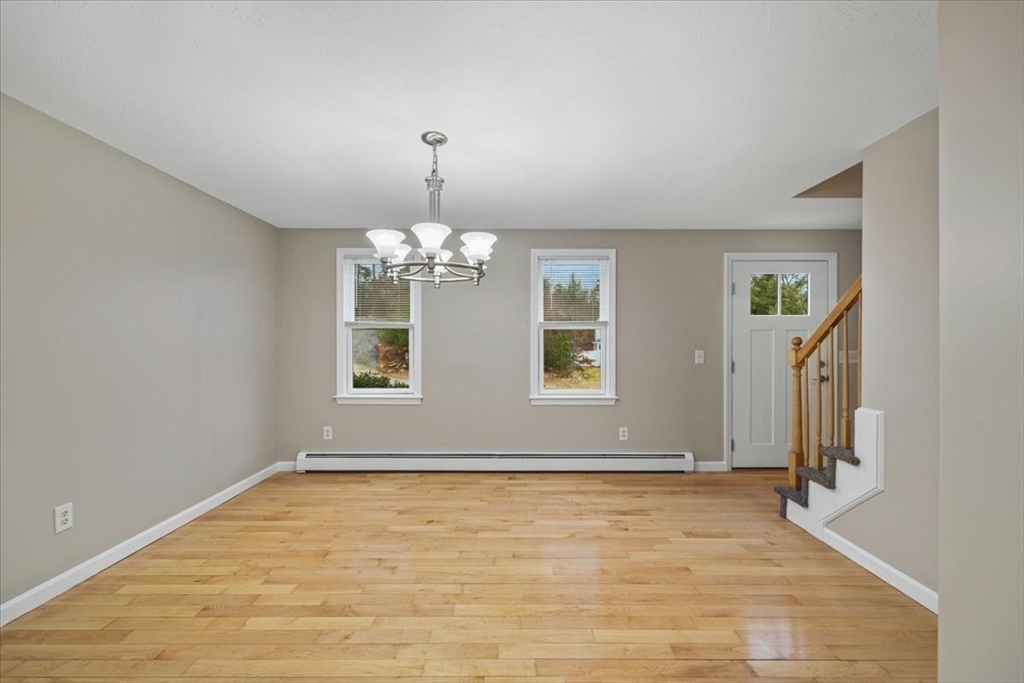 18 Heather Hill Road Bourne, MA 02532 - Photo 19 of 28 wooden floor in an empty room with a window