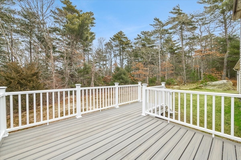 18 Heather Hill Road Bourne, MA 02532 - Photo 2 of 28 a view of a wooden roof deck