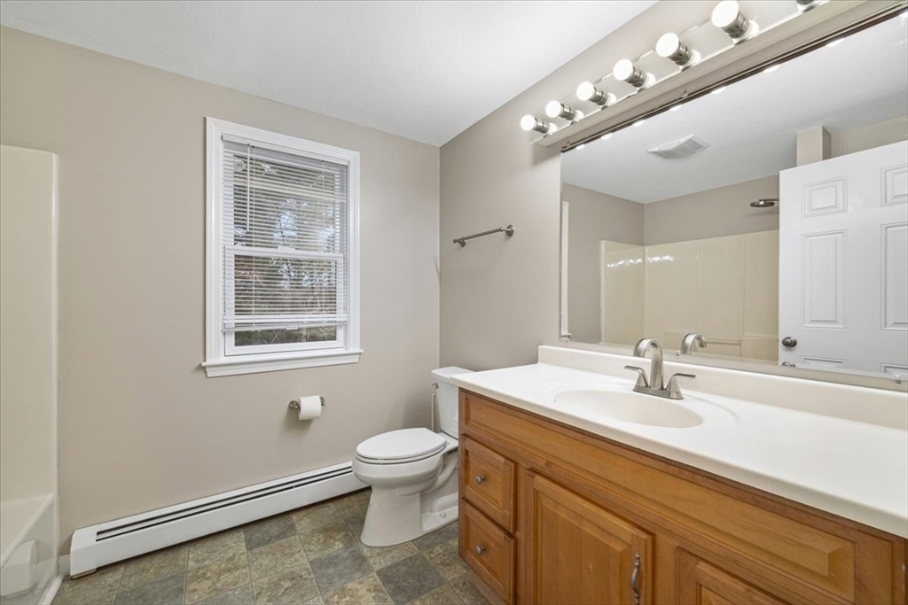 18 Heather Hill Road Bourne, MA 02532 - Photo 22 of 28 a bathroom with a toilet sink and mirror