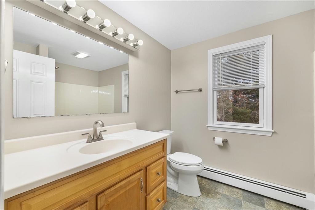 18 Heather Hill Road Bourne, MA 02532 - Photo 24 of 28 a bathroom with a sink vanity granite and toilet