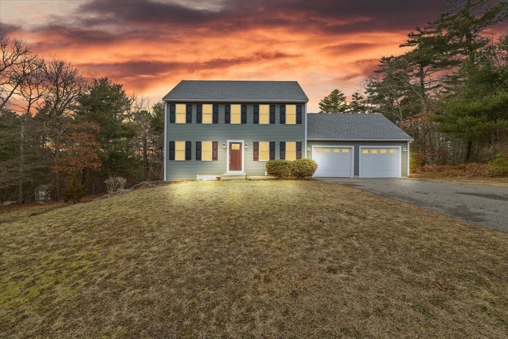 18 Heather Hill Road Bourne, MA 02532 - Photo 3 of 28 a front view of a house with a yard