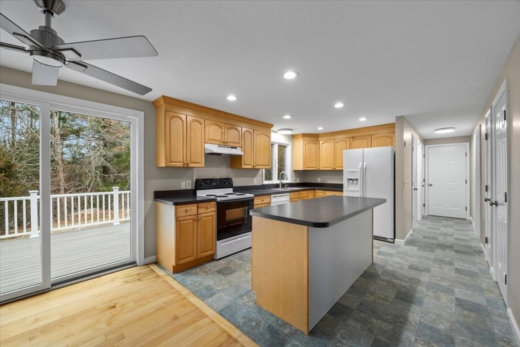 18 Heather Hill Road Bourne, MA 02532 - Photo 4 of 28 a kitchen with stainless steel appliances granite countertop a refrigerator and a stove top oven
