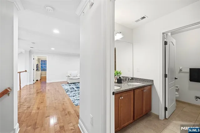 a bathroom with a sink and mirror