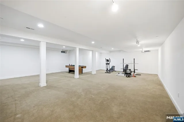 a view of a room with kitchen and a sink