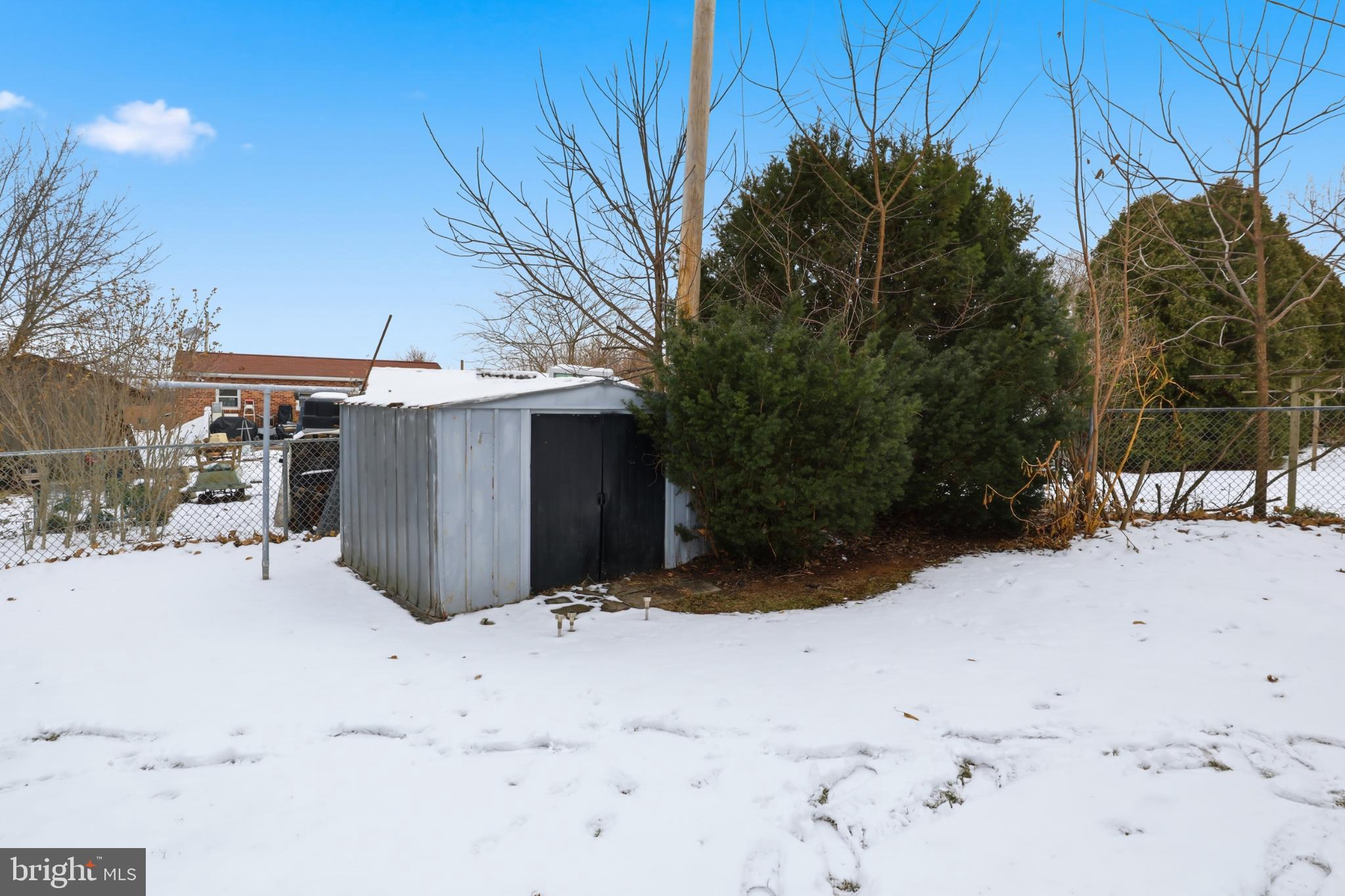 865 Taxville Road York, PA 17404 - Photo 37 of 40 Snowy yard with a rustic storage shed.