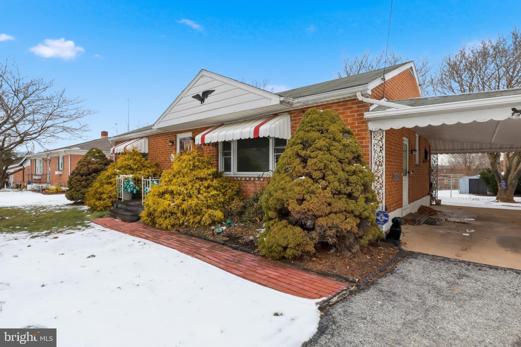 865 Taxville Road York, PA 17404 - Photo 5 of 40 Charming brick home with lush greenery.