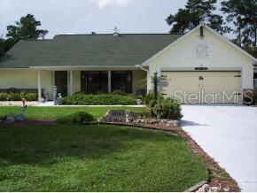 3050 Southwest 168th Loop Ocala, FL 34473 - Photo 1 of 1 a front view of a house with a yard