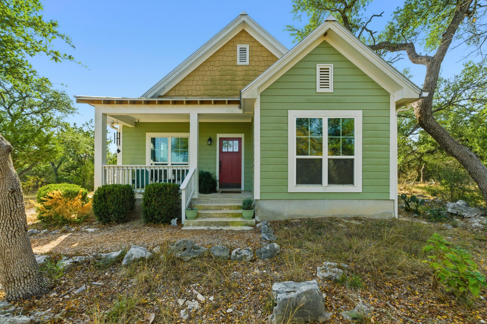a front view of a house with garden