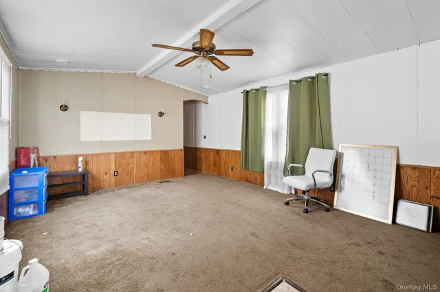 a view of livingroom with furniture and windows