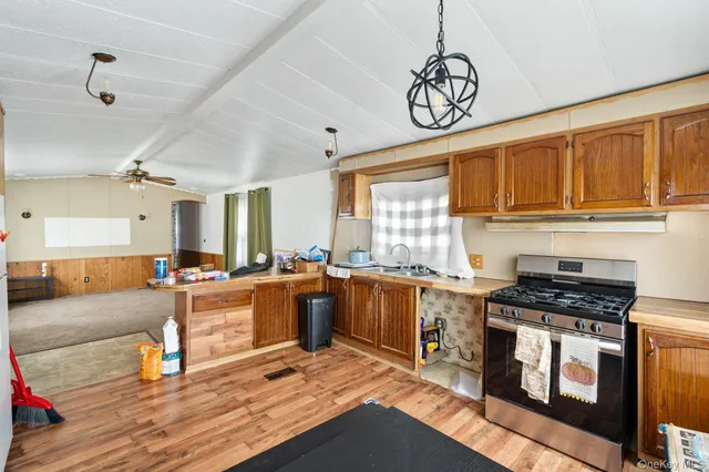 a kitchen with stove and cabinets