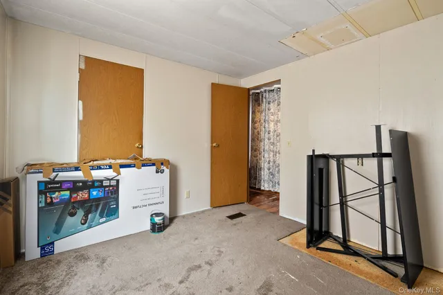 a view of room with workspace and windows