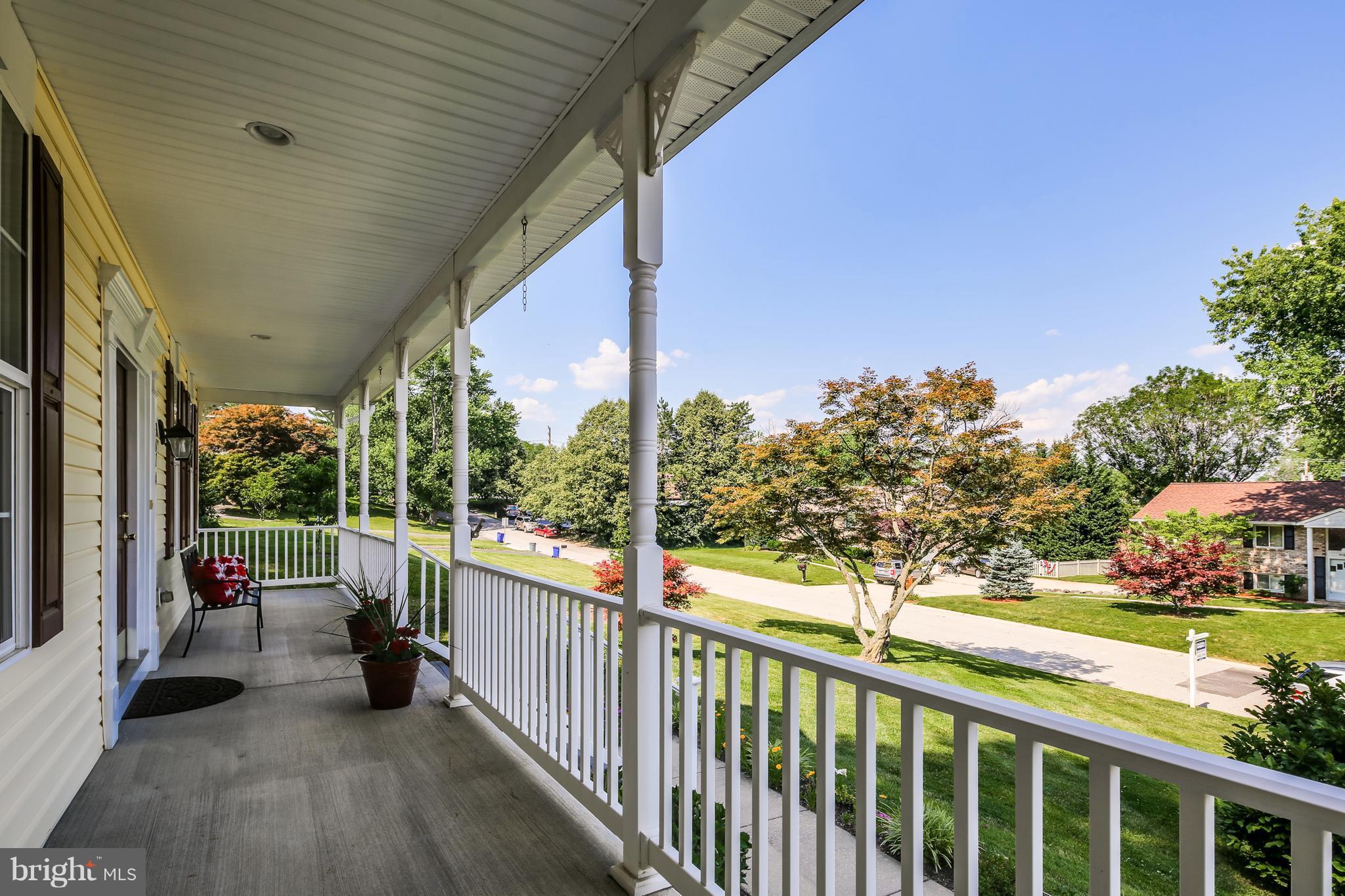 3614 Valley Road Ellicott City, MD 21042 - Photo 2 of 27 a view of a porch with wooden floor and iron fence