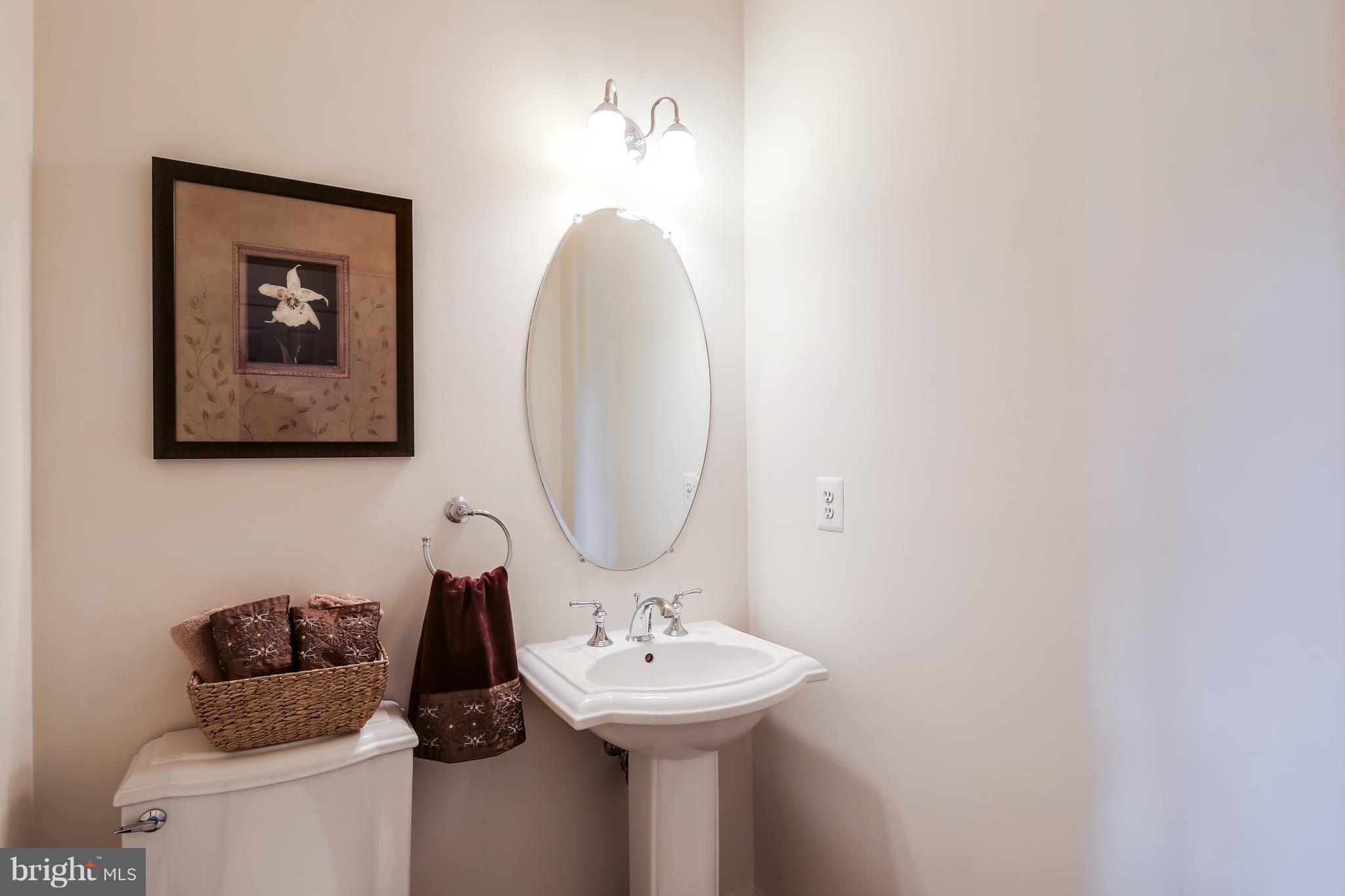 3614 Valley Road Ellicott City, MD 21042 - Photo 14 of 27 a bathroom with a sink and a mirror