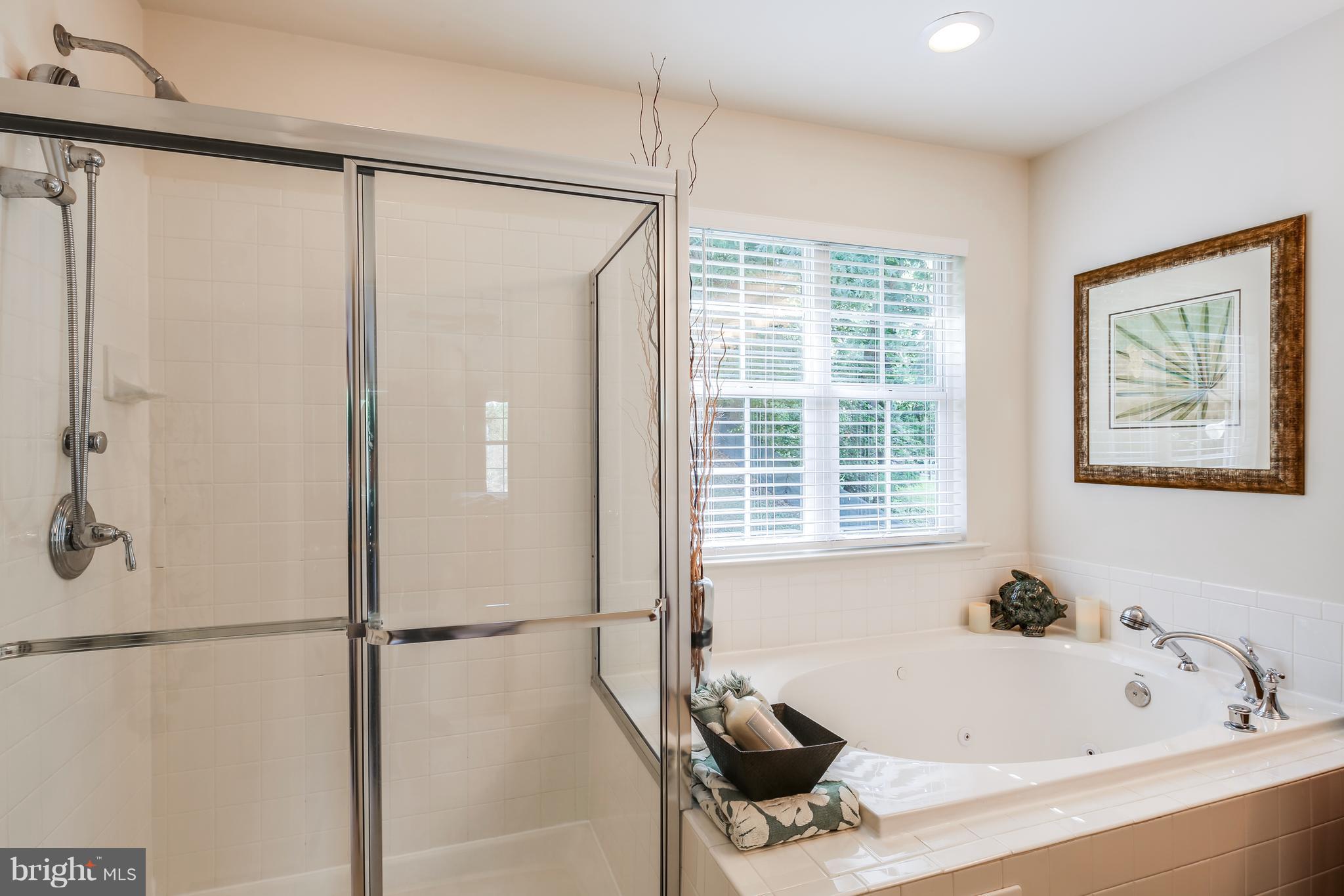 3614 Valley Road Ellicott City, MD 21042 - Photo 18 of 27 a bathroom with a bathtub and a shower