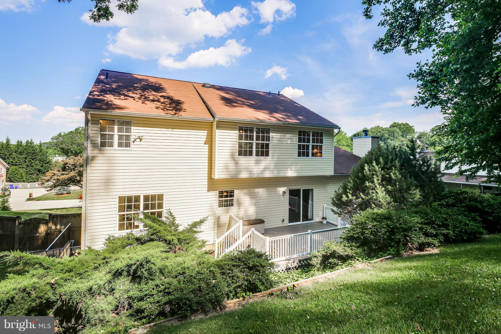 3614 Valley Road Ellicott City, MD 21042 - Photo 25 of 27 a front view of a house with a garden