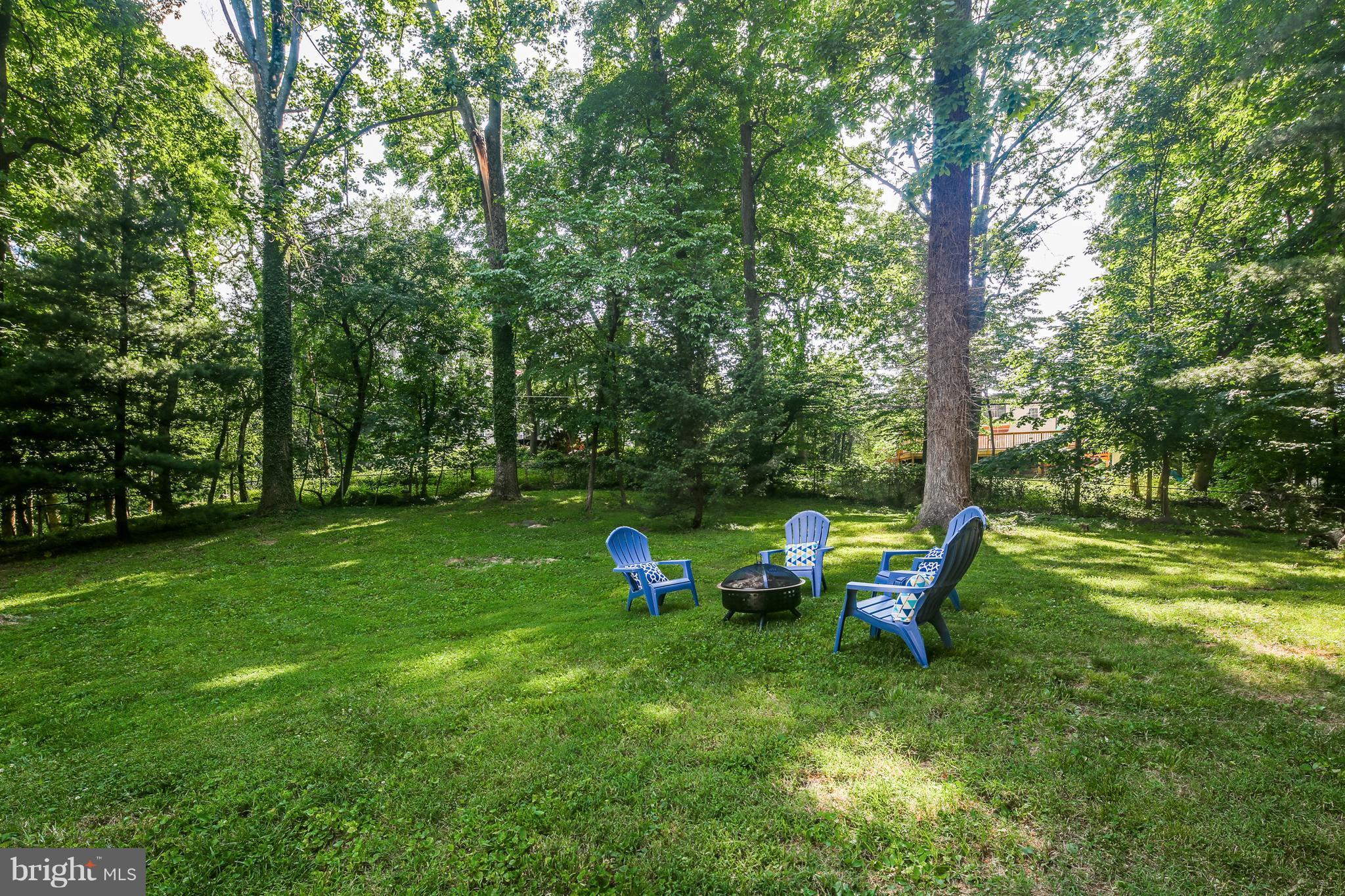 3614 Valley Road Ellicott City, MD 21042 - Photo 26 of 27 a backyard of a house with table and chairs