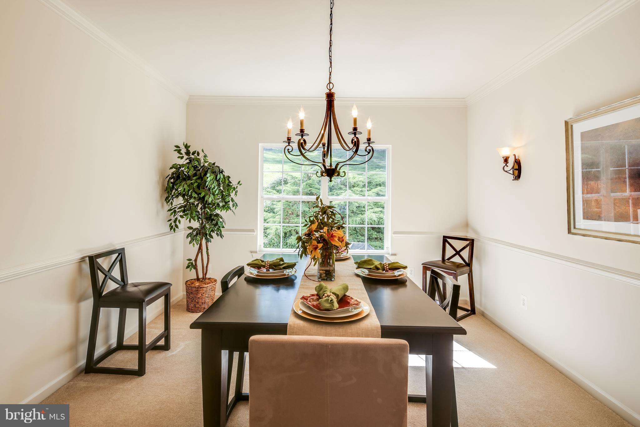 3614 Valley Road Ellicott City, MD 21042 - Photo 5 of 27 a view of a dining room with furniture and a chandelier