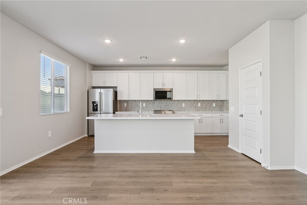 2070 Meyer Lane Redlands, CA 92374 - Photo 11 of 44 a view of kitchen with wooden floor