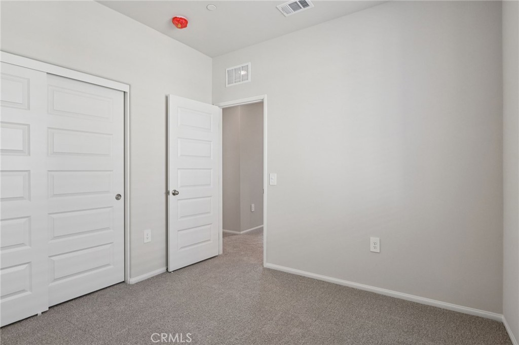 2070 Meyer Lane Redlands, CA 92374 - Photo 27 of 44 an empty room with closet area