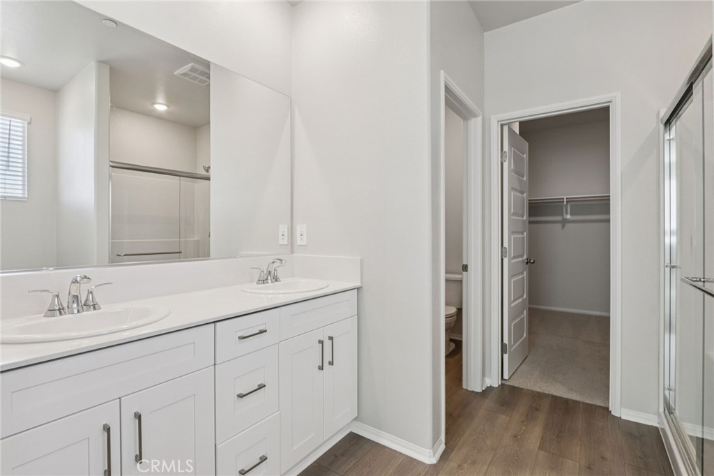 2070 Meyer Lane Redlands, CA 92374 - Photo 36 of 44 a bathroom with a double vanity sink and mirror