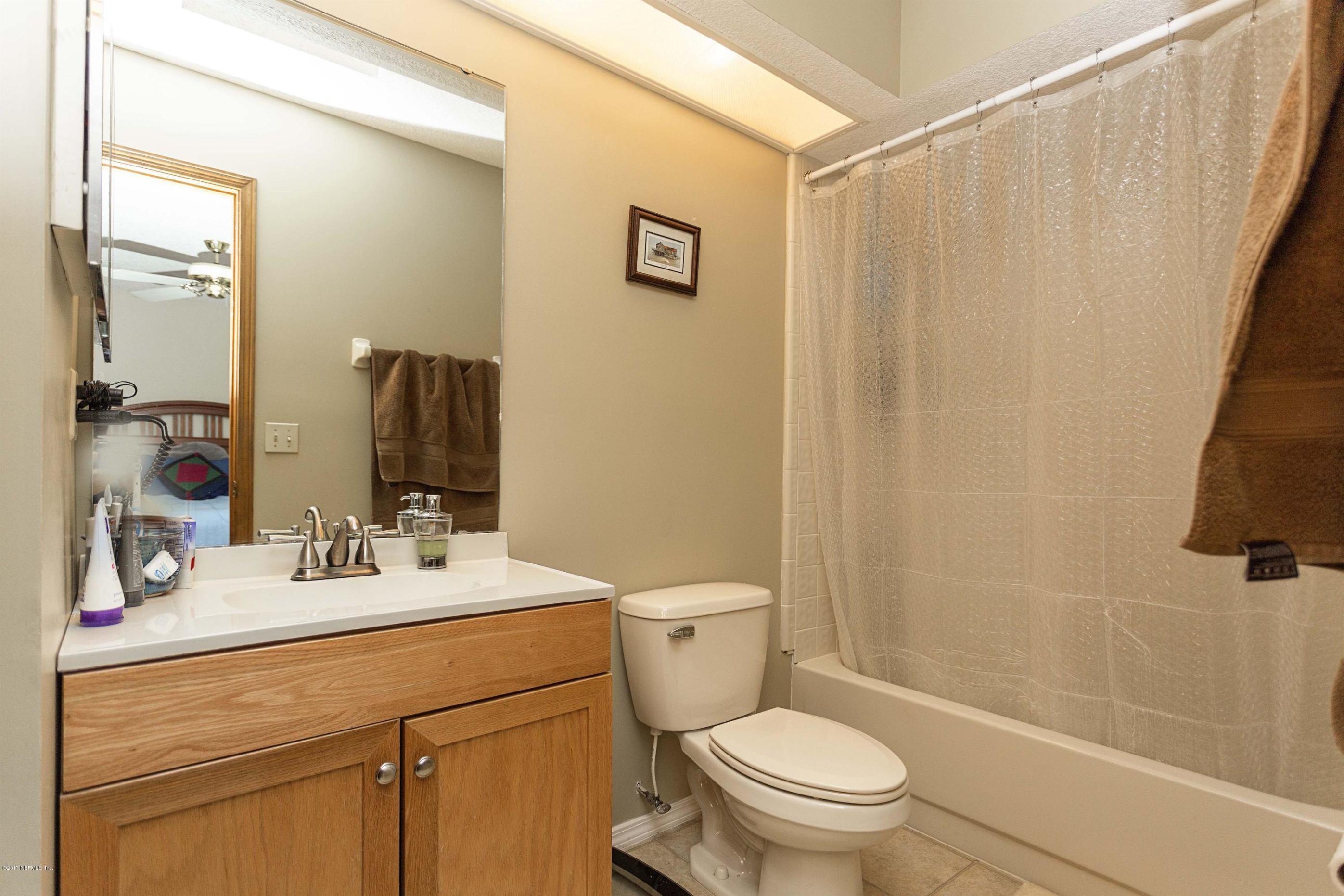 4775 Barnes Road South Jacksonville, FL 32207 - Photo 11 of 19 a bathroom with a sink a toilet and shower