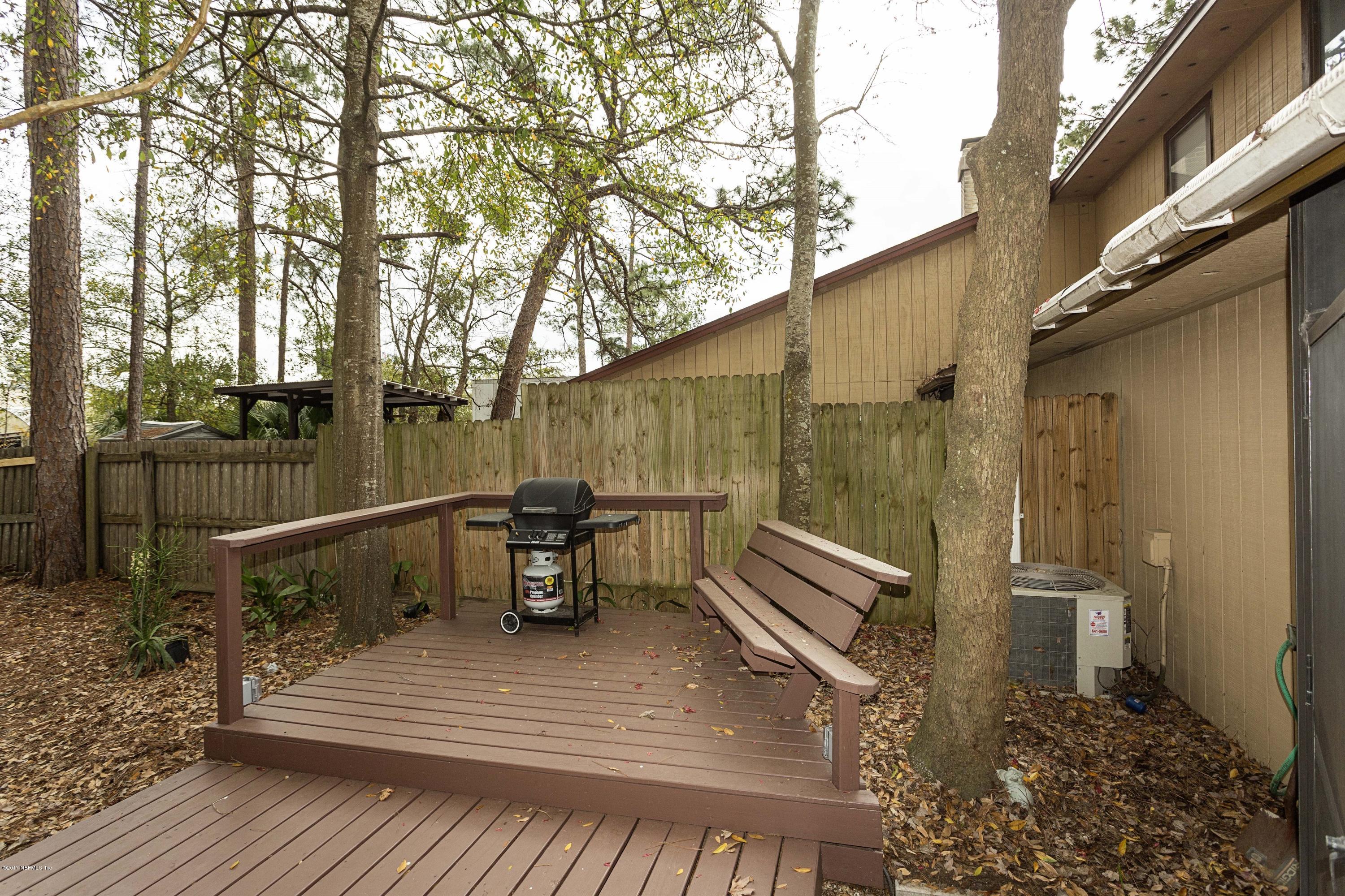 4775 Barnes Road South Jacksonville, FL 32207 - Photo 19 of 19 a backyard of a house with outdoor seating