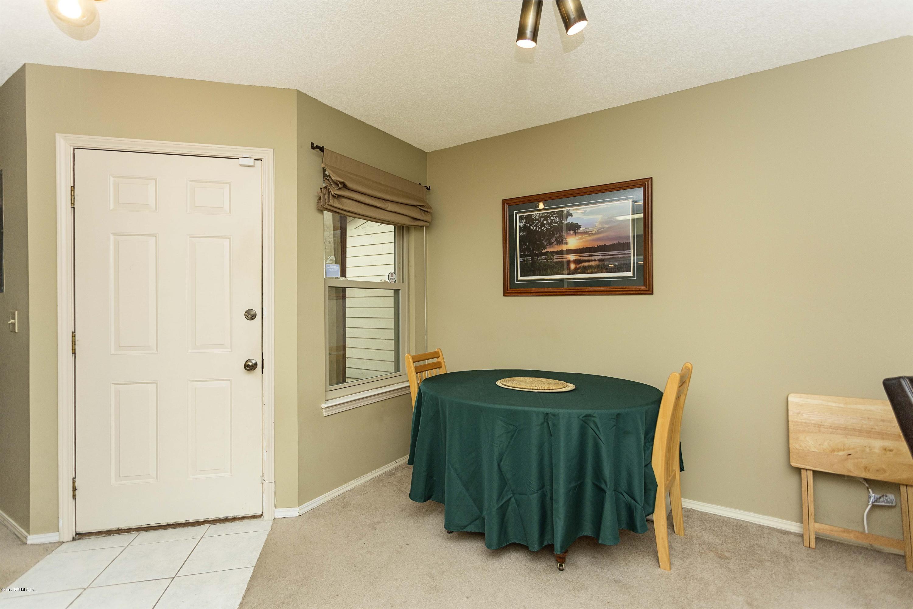 4775 Barnes Road South Jacksonville, FL 32207 - Photo 3 of 19 a view of a hallway with workspace and a window