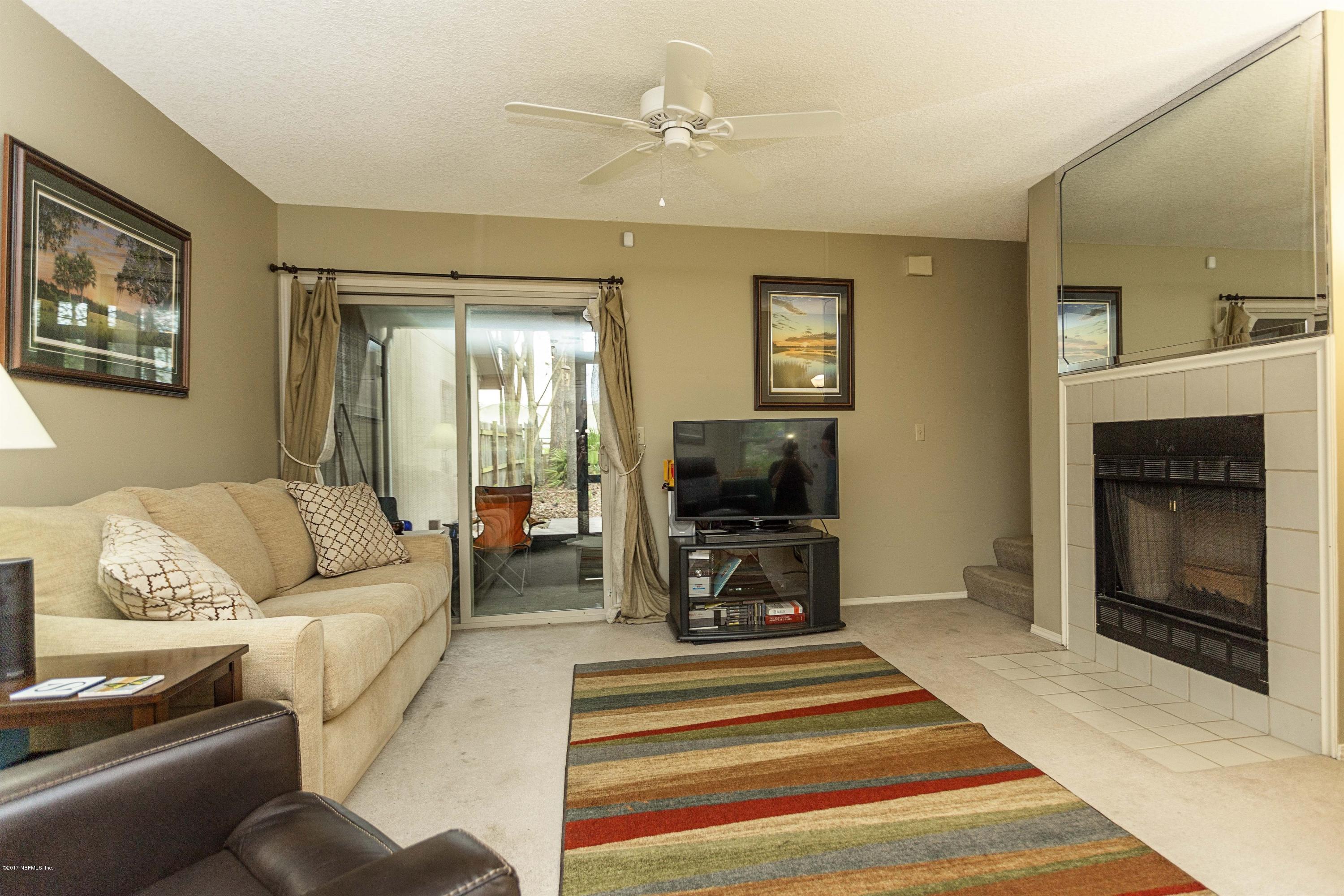 4775 Barnes Road South Jacksonville, FL 32207 - Photo 4 of 19 a living room with furniture and a fireplace