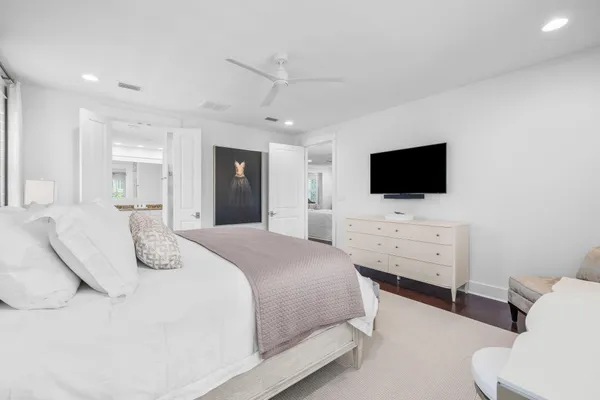 a bedroom with a bed and tv