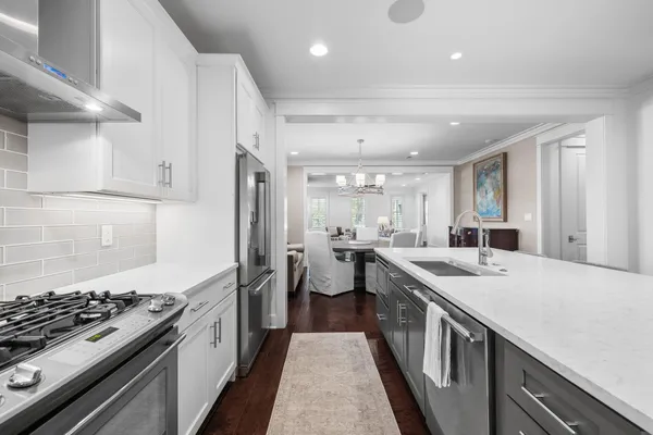 a kitchen with a stove and a sink